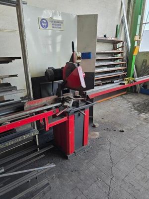 a picture of a machine that is working on a piece of metal