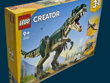 a box of legos with a dinosaur in it
