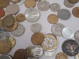 a lot of coins that are on the table