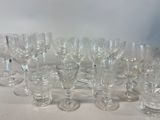 a lot of wine glasses sitting on a table