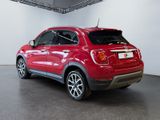 the rear end of a red fiat suv parked in a garage