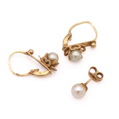 two pairs of pearl and gold earrings on a white background