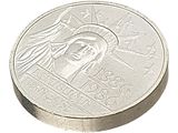 une image d'une pièce de monnaie en gros plan sur fond blanc
