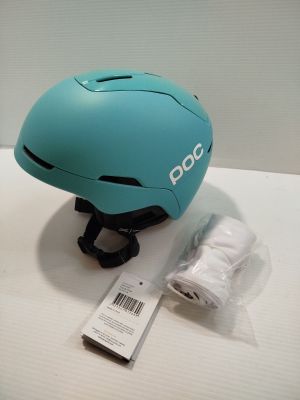 a helmet that is sitting on a table next to a pair of shoes