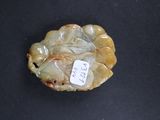 a small piece of jade with a tag on it