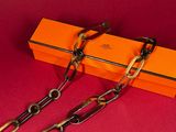 an orange box with a pair of scissors and a pair of scissors on it