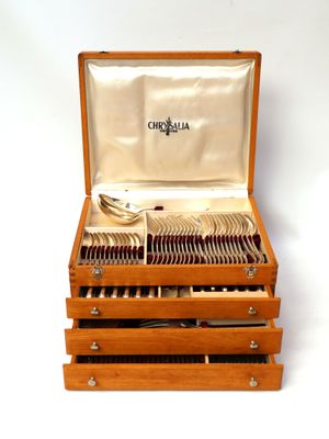 a wooden box with silverware in it on a white background
