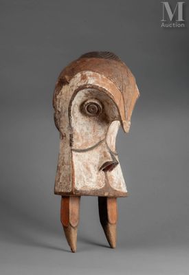 a close up of a wooden sculpture of a woman ' s head