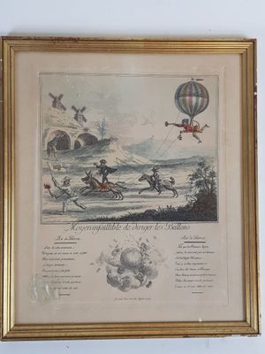 une vieille photo représentant un homme à cheval tenant un ballon