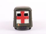 a small toy truck with a red cross on the front