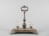 a silver plate with two glasses on top of it