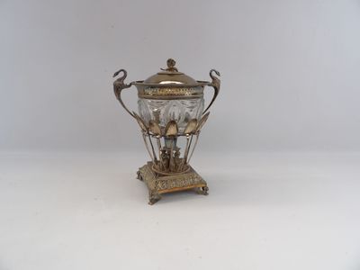 antique silver plated teapot on stand with two birds on top