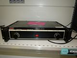 a black and white radio sitting on top of a shelf