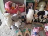 many stuffed animals that are sitting on the floor