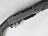 a close up of a gun on a white surface with a white background