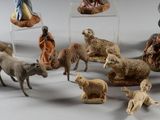 many figurines of people and animals in a circle