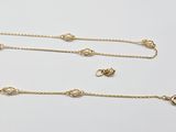 three gold chain bracelets and a gold chain necklace