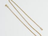 a gold necklace with a chain that is attached to it
