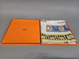 an orange box containing a pair of socks and a t - shirt