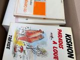 two books in a box that are sitting on top of each other