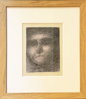 a black and white drawing of a man ' s face in a wooden frame
