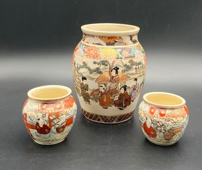 three vases sitting next to each other on a table