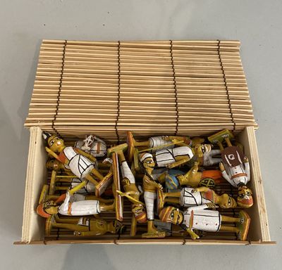 a cardboard box filled with assorted items on a table