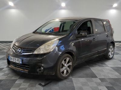 a picture of a small black car parked in a garage