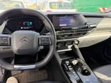 the interior of a car with a steering wheel, dashboard, and dash board