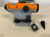 a close up of a surveying device on a table in a room