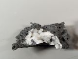 a piece of rock that has some kind of white substance on it