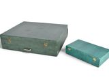a green suitcase and a green box on a white background