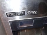 a close up of a metal oven with the words enomatic electric on it