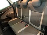 the back seats of a car with a remote control in it