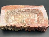 an image of a piece of rock with carvings on it