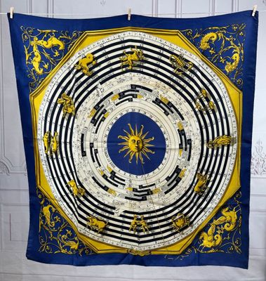 a blue and yellow scarf hanging on a wall