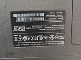 the back side of a laptop with a sticker on it