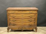 an antique chest of drawers on a wooden floor