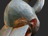 a close up of a sculpture of a bird on a black background