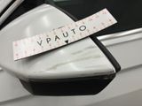 a sticker on the side mirror of a car with a measuring tape