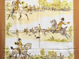 a brown and white scarf with a picture of men riding horses