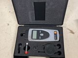 a black case that has a digital thermometer in it