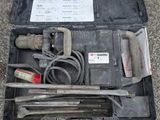 a tool kit in a case on the ground