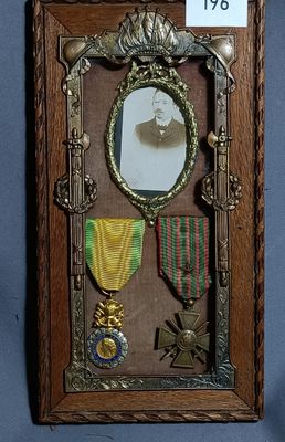 a picture of a picture of a man with medals in a frame