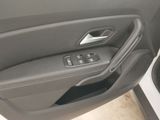 the interior of a car with the door open and the door handle open