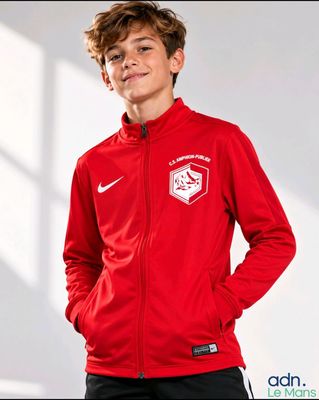 boy in a red jacket and black pants posing for a picture