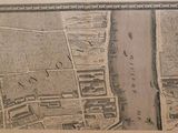an old map of a city with a river running through it