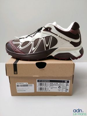 the shoe is sitting on top of a box on a table