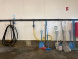 a lot of tools that are hanging on the wall