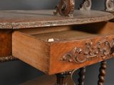a wooden desk with a mirror on top of it